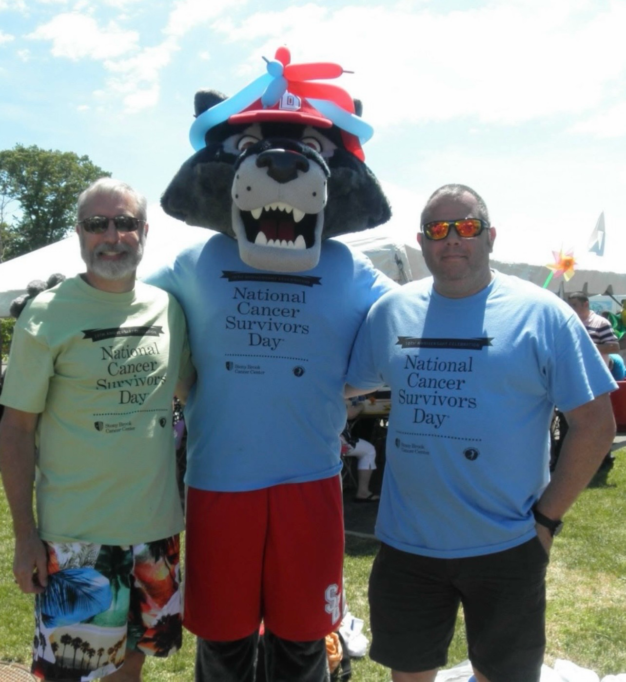 Man with Stony Brook mascot at National Cancer Survivors Day